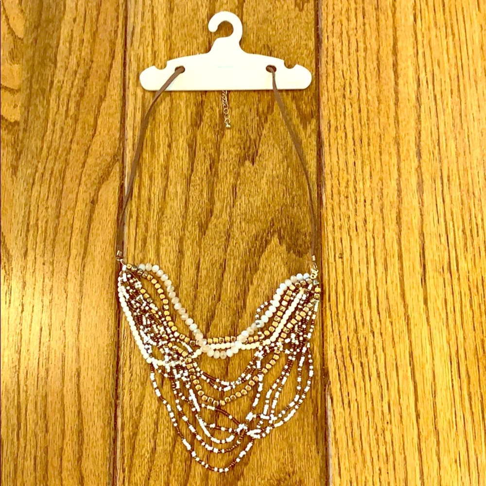 White, brown, and gold necklace from Maurices.